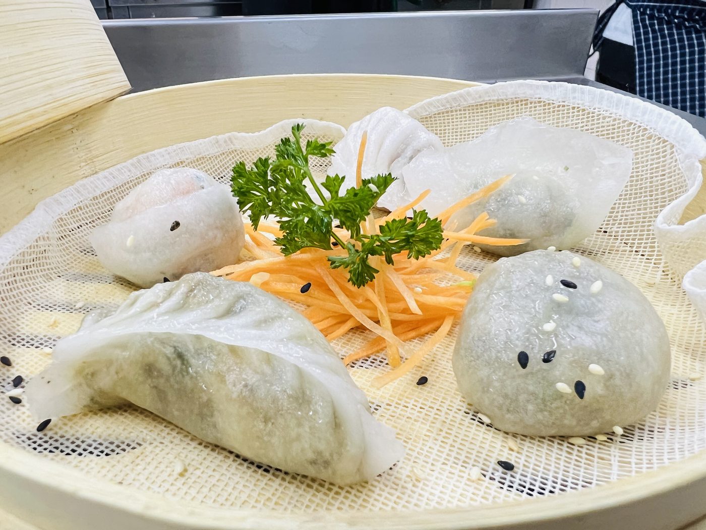 Steamed dumplings in a bamboo basket