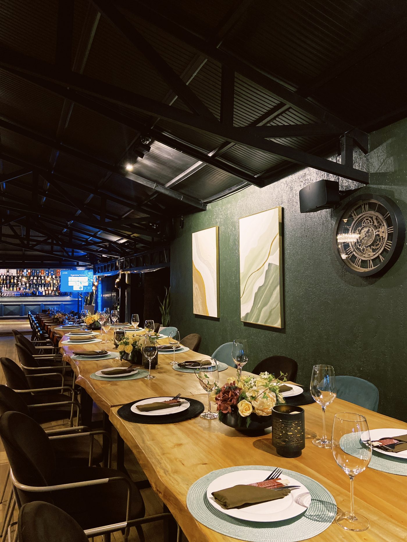 The private dining room with emerald walls and artwork